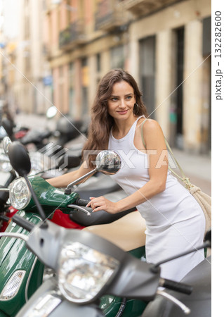 Young woman rents bike on city street 132282600