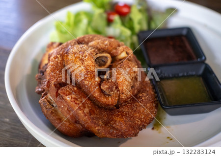 Crispy German pork knuckle served in the restaurant 132283124
