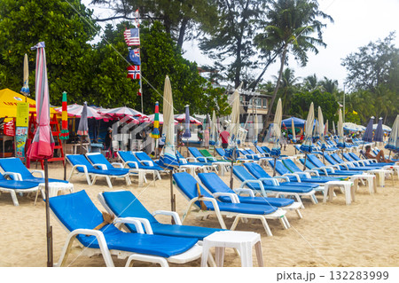 Patong Beach Phuket with people promenade turquoise blue water Thailand. Patong Beach Phuket with people promenade turquoise blue water Thailand. 132283999