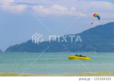 Patong Beach Phuket with turquoise blue water and parasailing Thailand. 132284105