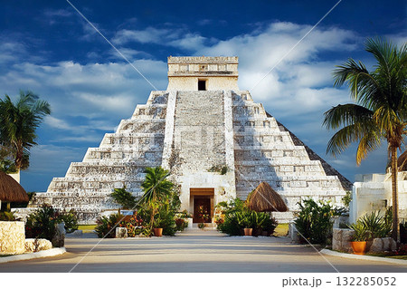 Ancient Mayan Ruins of Chichen Itza with Pyramid Temple Surrounded by Clear Sky and Lush Greenery in Mexico 132285052