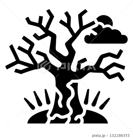 Silhouette of a leafless tree next to a cloud stands against the sky 132286355
