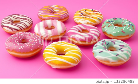 Colorful toping cream donuts sweet snack food on pink background Colorful toping cream donuts sweet snack food on pink background 132286488