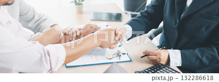 Panorama of successful real estate deal with handshake, contract, house key and calculator on desk, symbolizing mortgage loan approval, property investment, housing purchase and financial agreement. Panorama of successful real estate deal with handshake, contract, house key and calculator on desk, symbolizing mortgage loan approval, property investment, housing purchase and financial agreement. 132286618