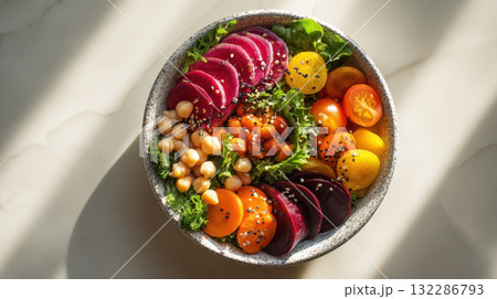 Beet chickpea tomato lettuce salad bowl healthy fresh vibrant vegetable top view 132286793