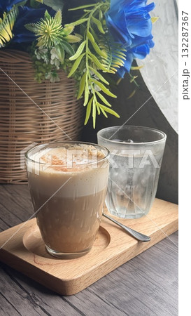 Steaming Hot Cappuccino in a Clear Glass Steaming Hot Cappuccino in a Clear Glass 132287367