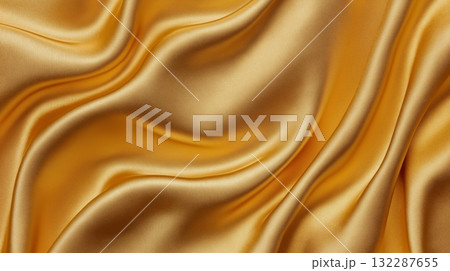 Luxurious golden silk fabric with smooth flowing texture 132287655