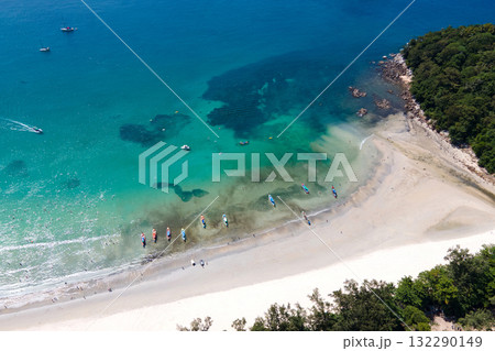 Aerial view of tropical shoreline at Kata Beach in Phuket, Thailand. Aerial view of tropical shoreline at Kata Beach in Phuket, Thailand. 132290149