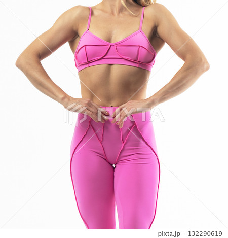 athletic female body in pink sportswear, fitness woman, athletic girl torso on white background 132290619