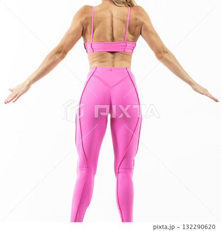 athletic female body in pink sportswear, fitness woman, athletic girl torso on white background athletic female body in pink sportswear, fitness woman, athletic girl torso on white background 132290620