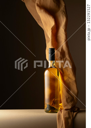 White wine and flutters of beige cloth. White wine and flutters of beige cloth. 132291527