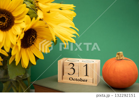 Halloween. Composition of sunflowers and pumpkins. Halloween Celebration on October 31 Halloween. Composition of sunflowers and pumpkins. Halloween Celebration on October 31 132292151