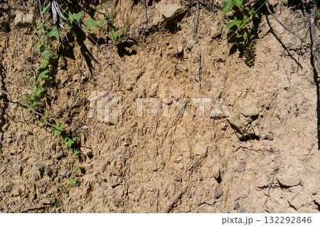 A detailed view of a quarry that is no longer in use. A detailed view of the crumbling remains of stone quarrying. 132292846