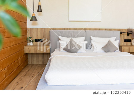 Peaceful bedroom with neat bed white bedding Peaceful bedroom with neat bed white bedding 132293419