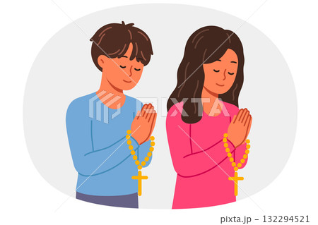 Christian children pray holding rosary with religious crosses and turning to god Christian children pray holding rosary with religious crosses and turning to god 132294521