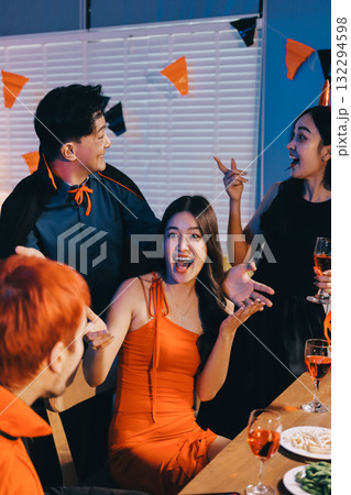 Joyful office Halloween party with coworkers in costumes, celebrating with drinks and laughter, fostering teamwork and festive spirit Joyful office Halloween party with coworkers in costumes, celebrating with drinks and laughter, fostering teamwork and festive spirit 132294598