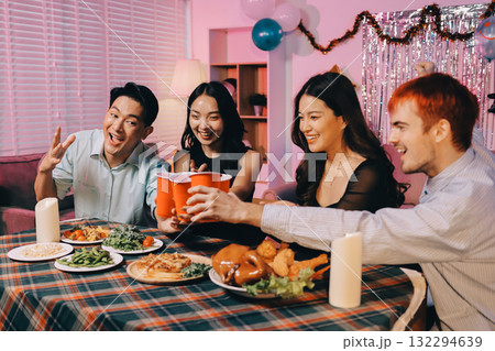 Diversity, dinner and group of people toast celebration together at party. Friends, happy and celebrate with food, wine and friendship for love, support and cheers champagne at business function Diversity, dinner and group of people toast celebration together at party. Friends, happy and celebrate with food, wine and friendship for love, support and cheers champagne at business function 132294639