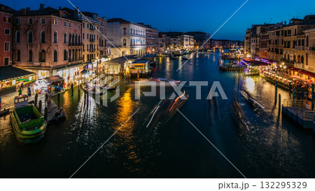 Grand Canal in Venice, Italy day to night timelapse. Gondolas and city lights from Rialto Bridge. Grand Canal in Venice, Italy day to night timelapse. Gondolas and city lights from Rialto Bridge. 132295329