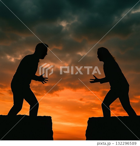 Silhouettes of man and woman arguing on cliffs at sunset dramatic sky 132296589