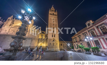 La Giralda and Seville Cathedral timelapse hyperlapse glowing under the night sky. 132296680