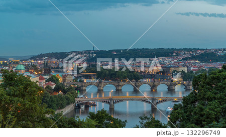 Scenic view of bridges on the Vltava river day to night timelapse and of the historical center of Prague: buildings 132296749