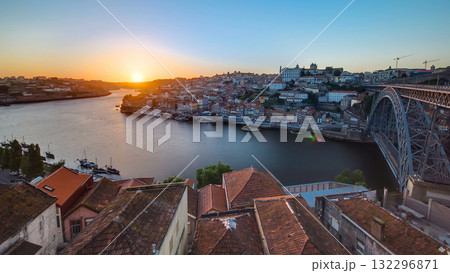 Panorama of old city Porto at river Duoro,with Port transporting boats at sunset timelapse, Oporto, Portugal Panorama of old city Porto at river Duoro,with Port transporting boats at sunset timelapse, Oporto, Portugal 132296871