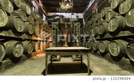 Barrels in the wine cellar with table and candle on it, Portugal timelapse Barrels in the wine cellar with table and candle on it, Portugal timelapse 132296884