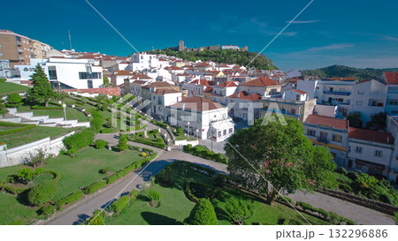 Castle with houses with red roof near the city Sesimbra, Atlantic coast of Portugal timelapse 132296886