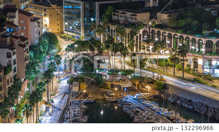Fontvieille night timelapse - new district of Monaco. Boats, yachts in harbor and a high-rise apartment complex. Fontvieille night timelapse - new district of Monaco. Boats, yachts in harbor and a high-rise apartment complex. 132296966