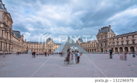 Tourists walk near the Louvre in Paris timelapse hyperlapse 132296979