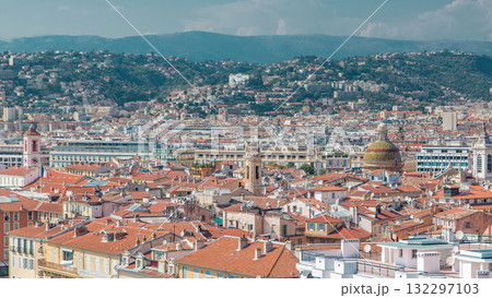 Bright sun lights red roofs of the old city timelapse. Aerial view from Shatto's hill. Nice, France Bright sun lights red roofs of the old city timelapse. Aerial view from Shatto's hill. Nice, France 132297103