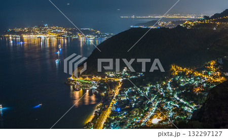 Night timelapse view of the Mediterranean coastline of the town of Eze village on the French Riviera 132297127