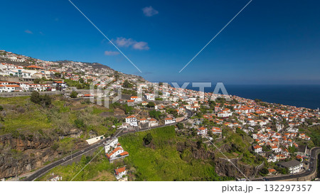 Aerial view from the mountain over the rooftops from cable car on Madeira timelapse hyperlapse. Aerial view from the mountain over the rooftops from cable car on Madeira timelapse hyperlapse. 132297357