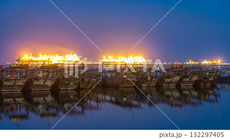 Fishing boat parked near the fish market next to Kuwait City Area day to night timelapse Fishing boat parked near the fish market next to Kuwait City Area day to night timelapse 132297405