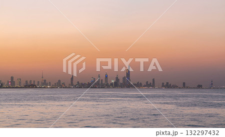 Skyline with Skyscrapers day to night timelapse in Kuwait City downtown illuminated at dusk. Kuwait City, Middle East 132297432