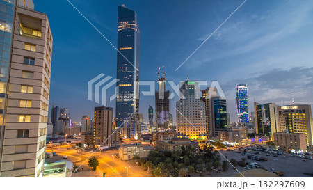 Skyline with Skyscrapers day to night timelapse in Kuwait City downtown illuminated at dusk. Kuwait City, Middle East Skyline with Skyscrapers day to night timelapse in Kuwait City downtown illuminated at dusk. Kuwait City, Middle East 132297609