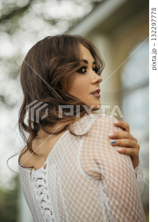 young girl bride in a white dress in a spring forest on a wedding day young girl bride in a white dress in a spring forest on a wedding day 132297778