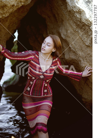 Attractive woman in red dress on top Attractive woman in red dress on top 132297787
