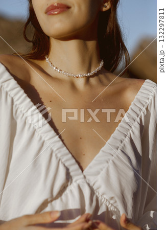 Elegant lady and eye-catching silver and gold necklace. E-commerce online sales 132297811