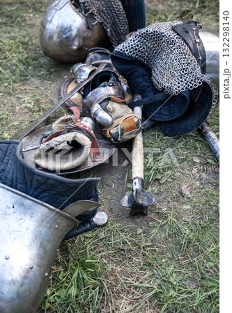 The knight's iron armor lies on the ground 132298140