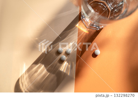 White medical pills lie on the background. White medical pills lie on the background. 132298270