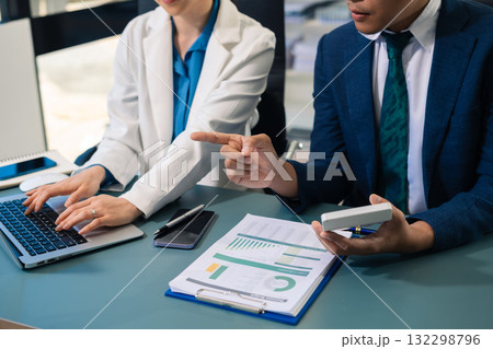 Business people discussing on performance revenue in meeting. financial adviser analyzing data with investor at office. Business people discussing on performance revenue in meeting. financial adviser analyzing data with investor at office. 132298796