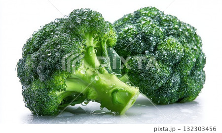 Fresh green broccoli florets with water droplets on white background highlighting healthy vegetable nutrition and organic produce Fresh green broccoli florets with water droplets on white background highlighting healthy vegetable nutrition and organic produce 132303456