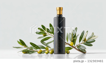Premium olive oil bottle with golden cap and fresh olive branch with green olives on white background for gourmet cooking Premium olive oil bottle with golden cap and fresh olive branch with green olives on white background for gourmet cooking 132303481