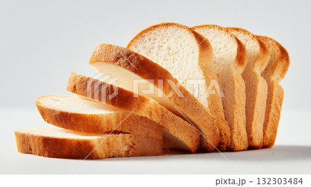 Sliced white bread loaf arranged in overlapping layers showing soft texture, fresh bakery product for sandwiches and toast Sliced white bread loaf arranged in overlapping layers showing soft texture, fresh bakery product for sandwiches and toast 132303484