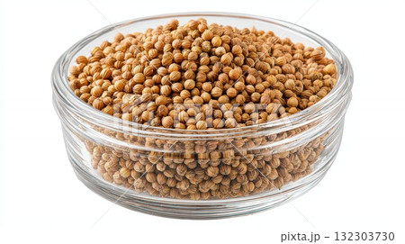 Coriander seeds in glass bowl on white background, whole dried spice for cooking, seasoning and flavoring food in kitchen Coriander seeds in glass bowl on white background, whole dried spice for cooking, seasoning and flavoring food in kitchen 132303730