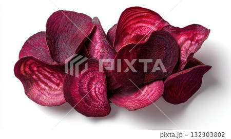 Dried beetroot chips arranged in artistic pile showing vibrant magenta color and natural texture, healthy vegetable snack for organic food photography 132303802