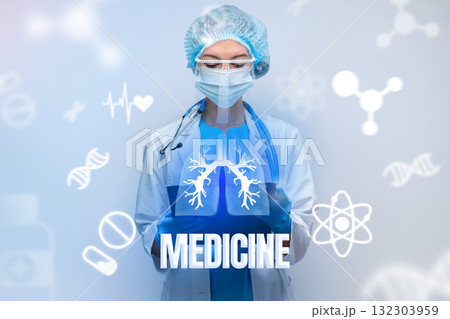 Healthcare professional in a lab coat and mask holding a tablet with medical symbols Healthcare professional in a lab coat and mask holding a tablet with medical symbols 132303959