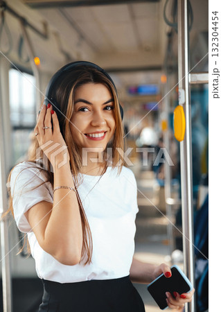 Young Woman Enjoying Music in Public Transport During a Sunny Day in the City Young Woman Enjoying Music in Public Transport During a Sunny Day in the City 132304454