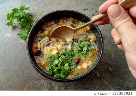 Red bean soup with potatoes, tomatoes, paprika, carrot, and bacon. 132307921